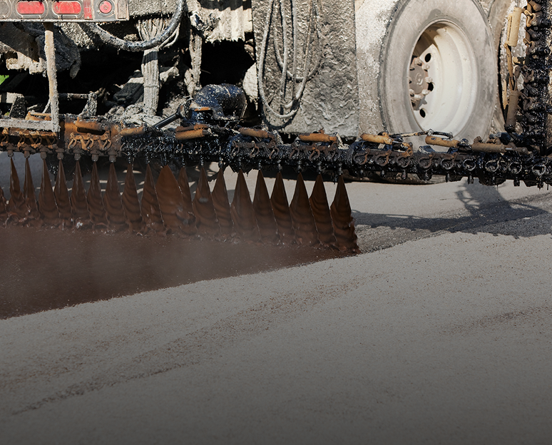 Paving machine laying new asphalt layer