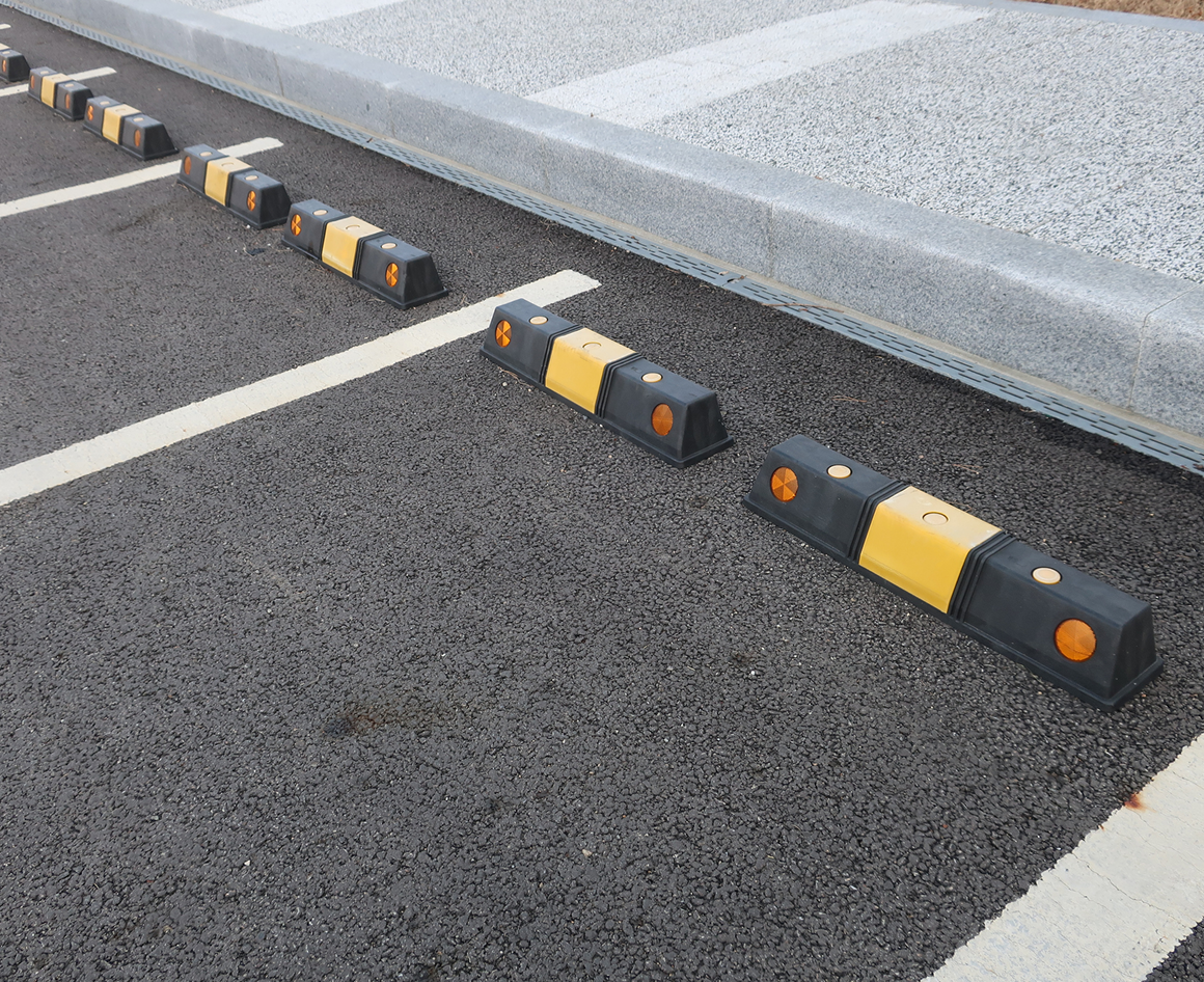 Empty parking spaces with curbs