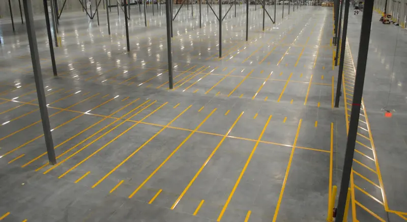 Empty warehouse with marked floor spaces