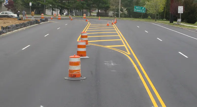 Street with caution cones and markings